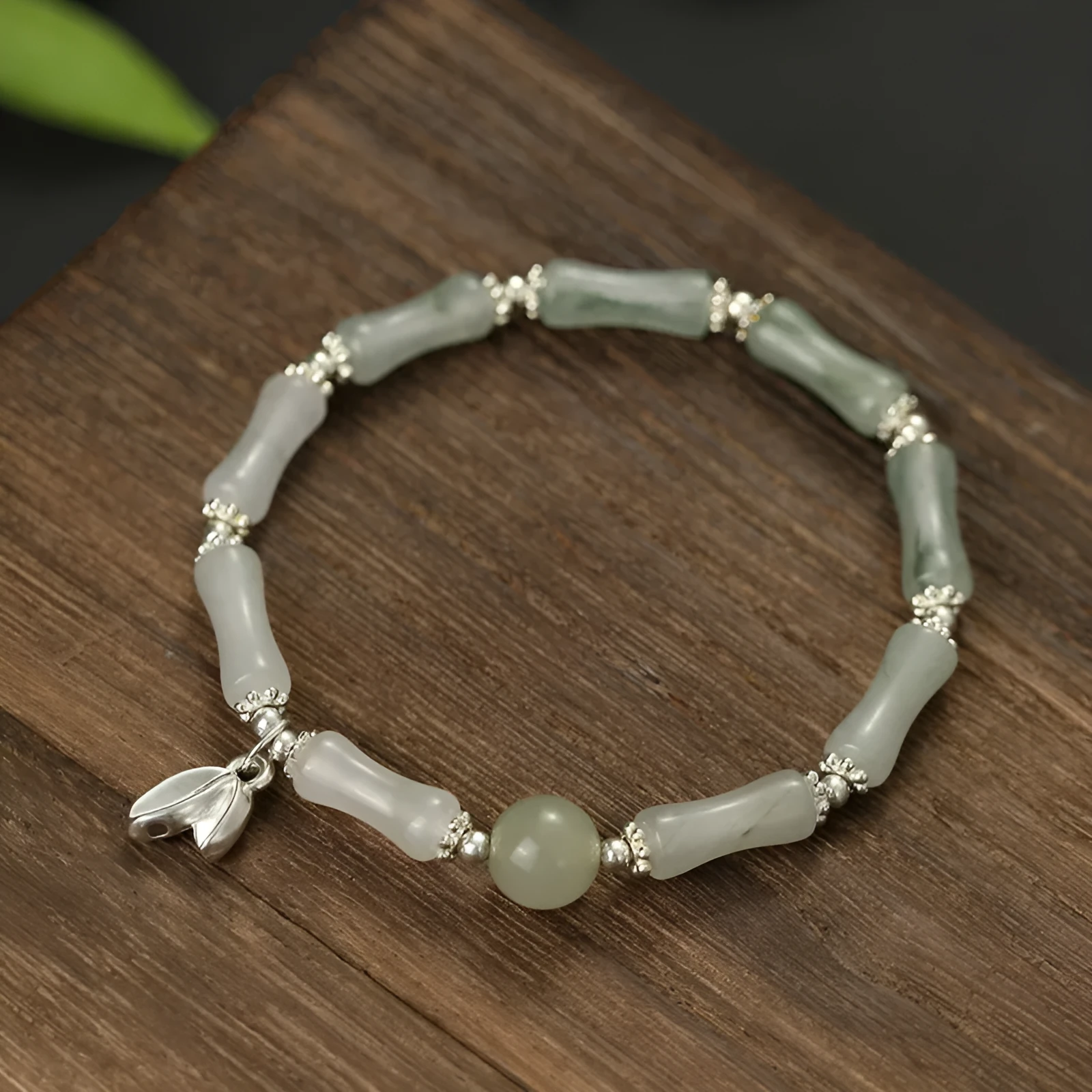 Women's antique style bracelet made from Tianshan green bamboo and sterling silver with bamboo joint detailing