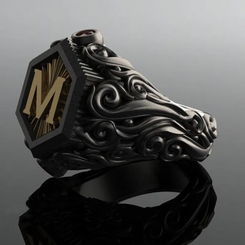 Black alloy decorative ring with carved leaf design on white background