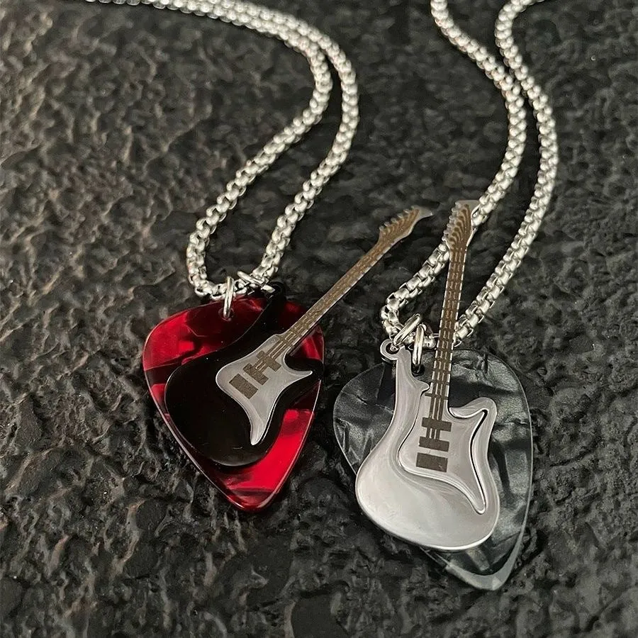 Black guitar pendant necklace in titanium steel on box chain, lithographic finish, women's punk rock style accessory.