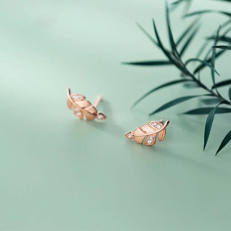 Copper willow leaf stud earrings with micro-inlaid leaf detailing, rose gold or white gold finish, side view on white background