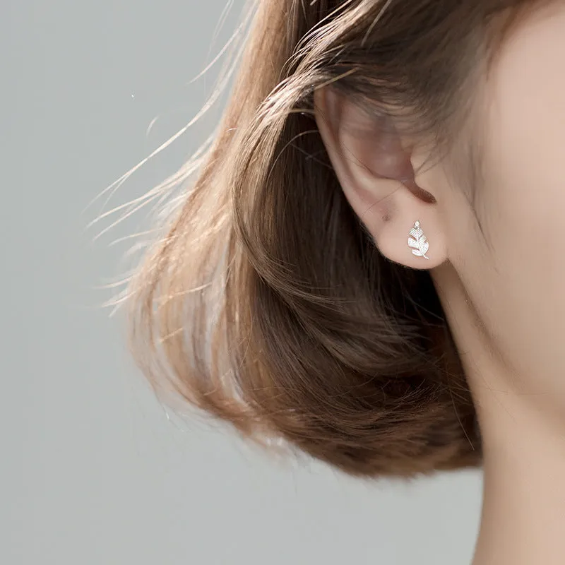 Copper willow leaf stud earrings with micro-inlaid leaf detailing, rose gold or white gold finish, side view on white background