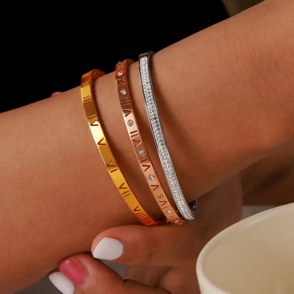 Retro Roman numeral titanium steel gold-plated bracelet with diamond accents on wrist