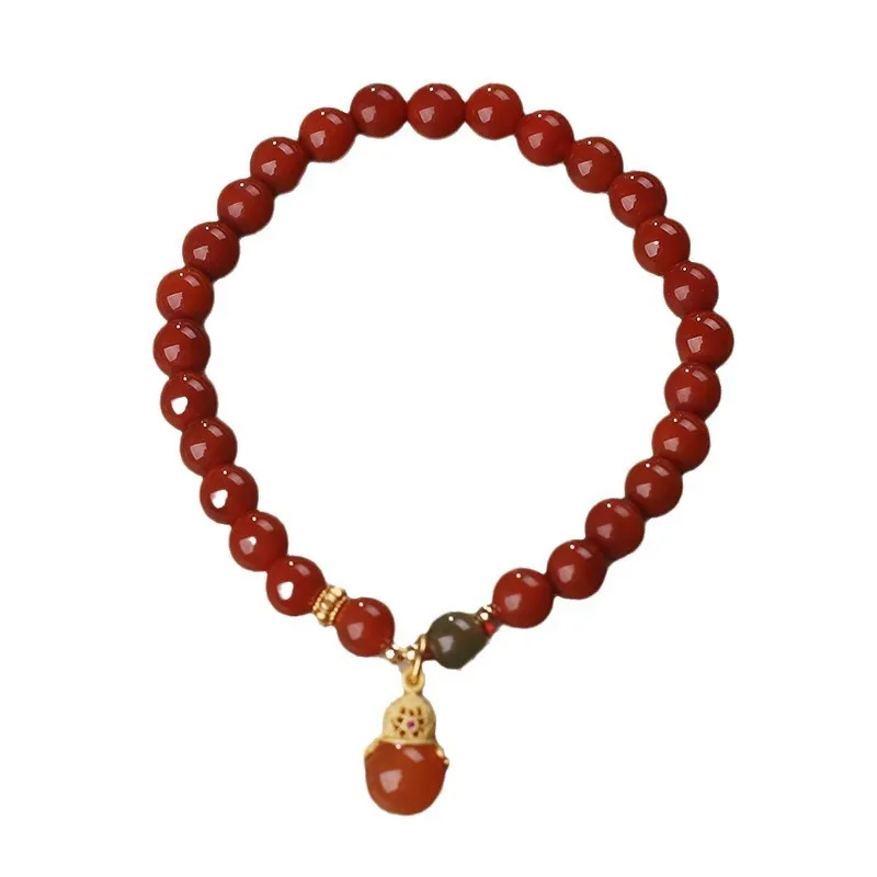 Natural red agate bracelet with zodiac pendant on wrist