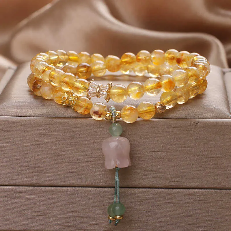 Women's crystal bracelet with natural gold rutilated quartz yellow tower double ring Lily pendant, pearl and rhinestone accents, 34cm length