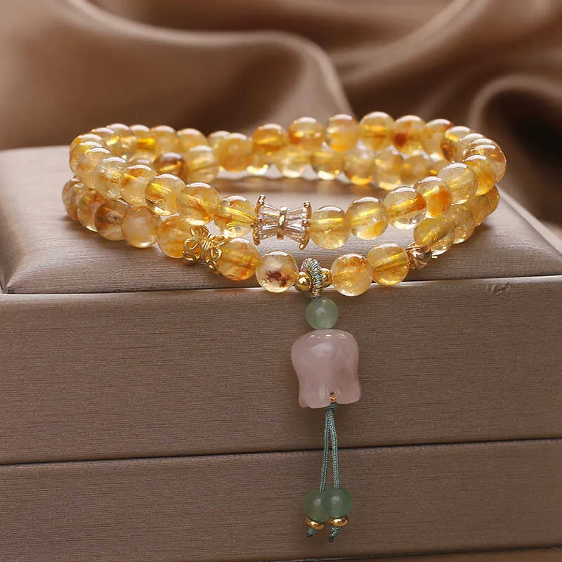 Women's crystal bracelet with natural gold rutilated quartz yellow tower double ring Lily pendant, pearl and rhinestone accents, 34cm length