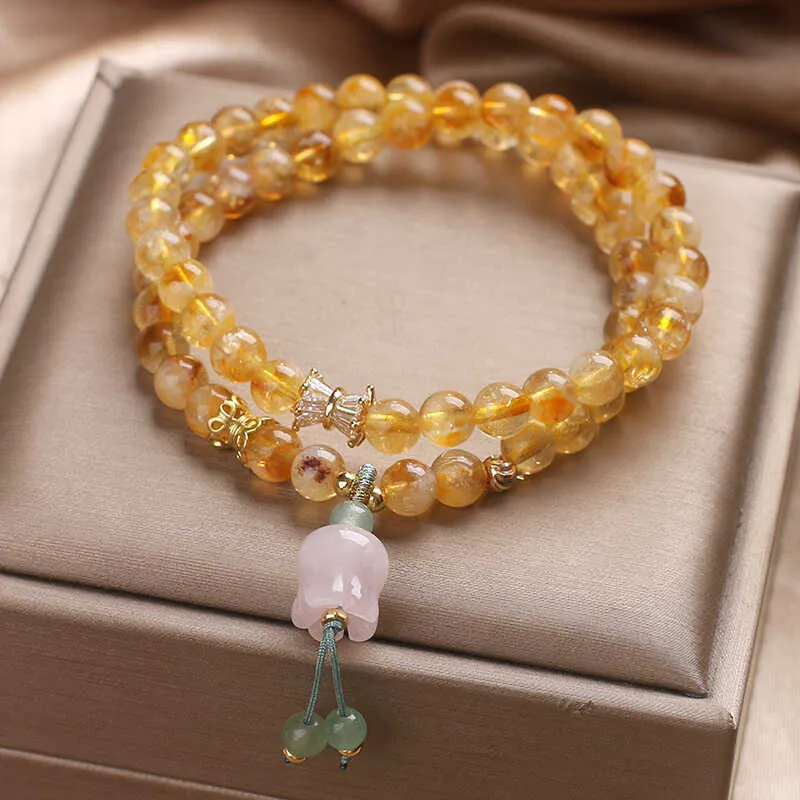Women's crystal bracelet with natural gold rutilated quartz yellow tower double ring Lily pendant, pearl and rhinestone accents, 34cm length