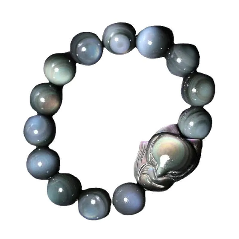 Obsidian stone bracelet with carved fox design in cartoon style, shown in different diameter sizes.