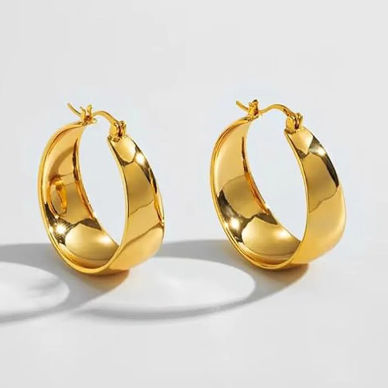 Widened curved stainless steel earrings in gold and steel colours showing 25mm and 30mm size options