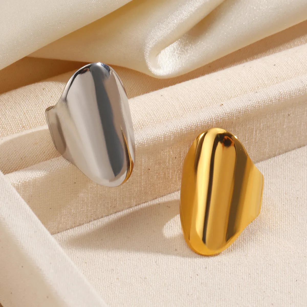Exaggerated thick geometric stainless steel ring for women, available in gold and steel colour options