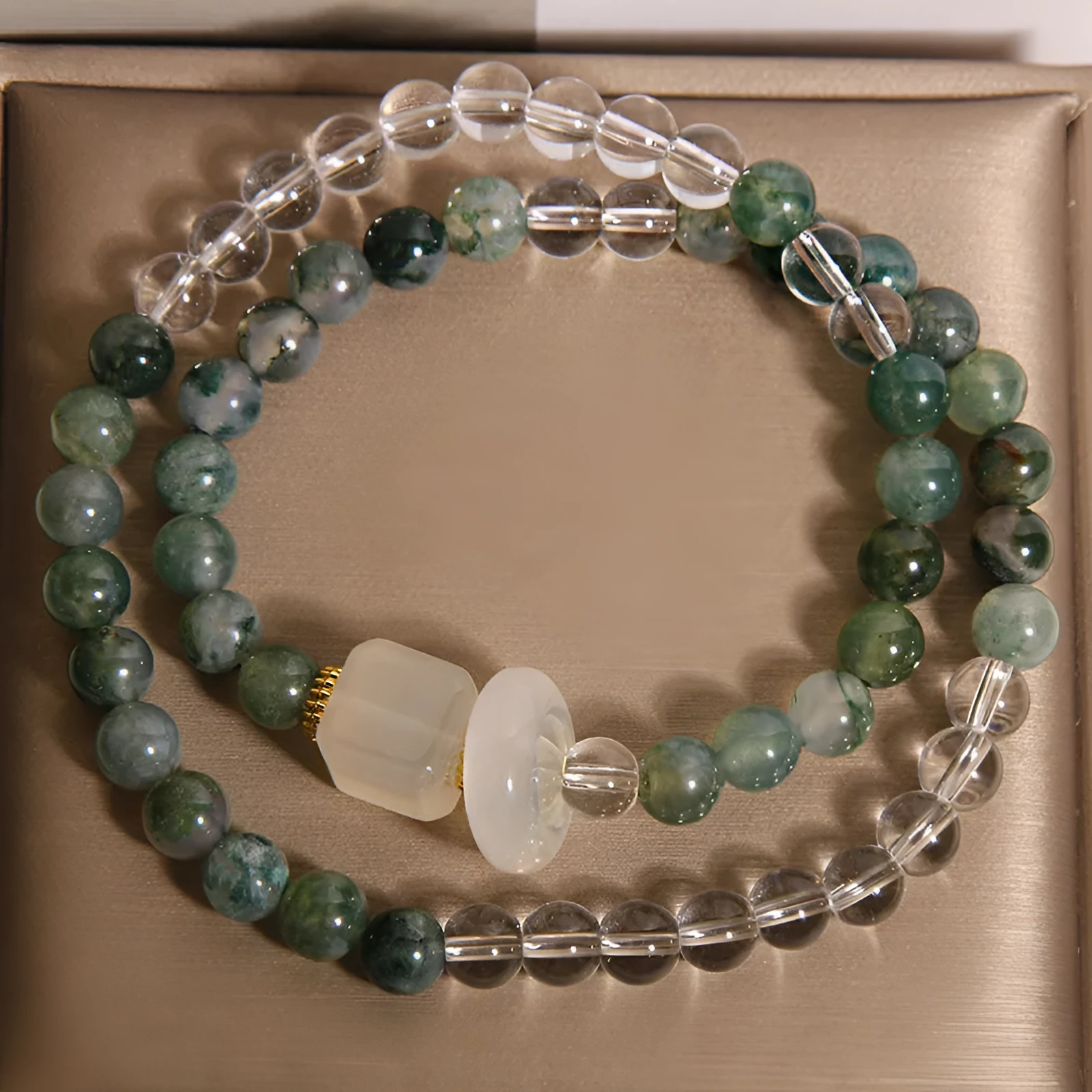 Double circle green grass agate and white agate cube sugar bracelet on a neutral background