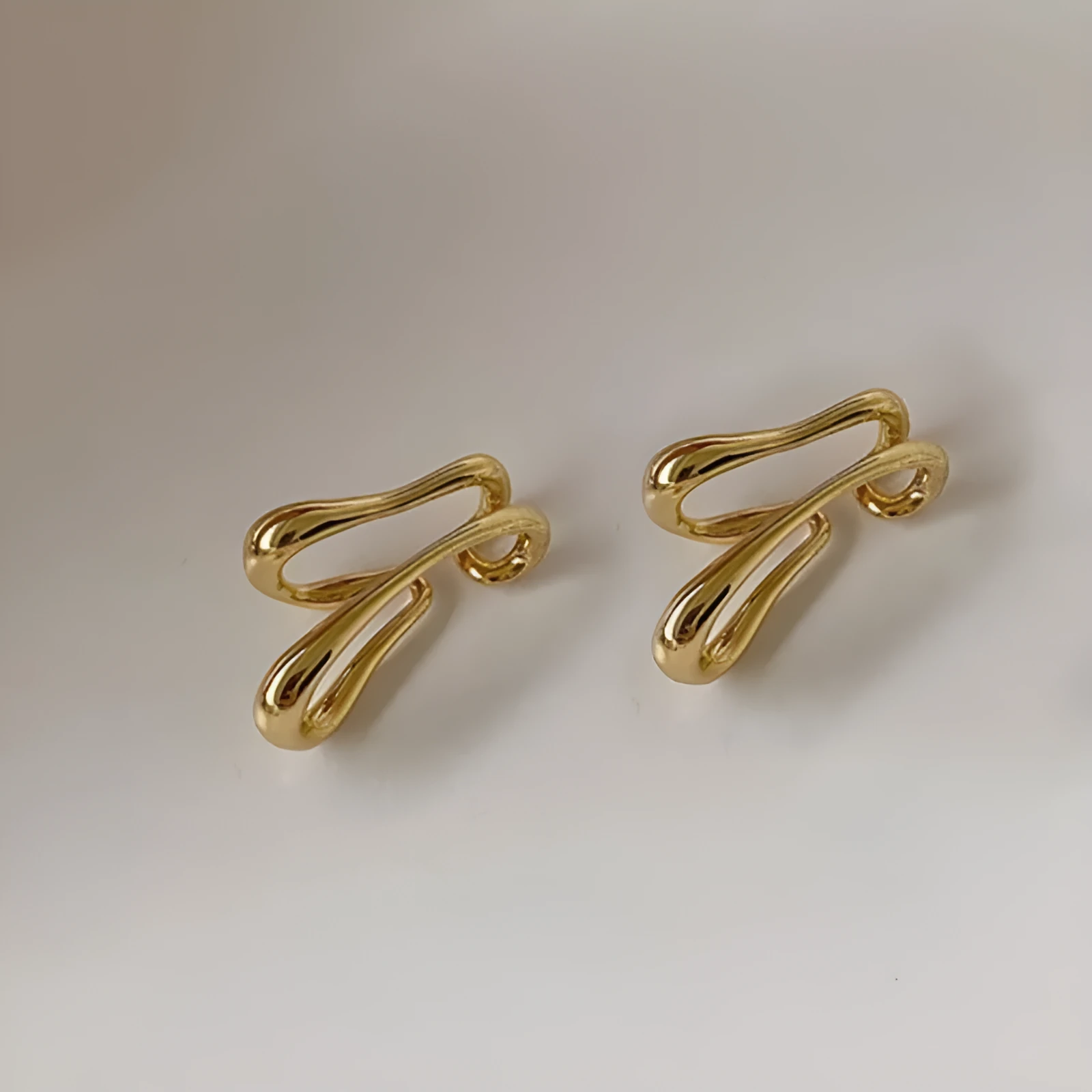 Double-layer geometric line copper ear clip earrings in gold and silver finish for women