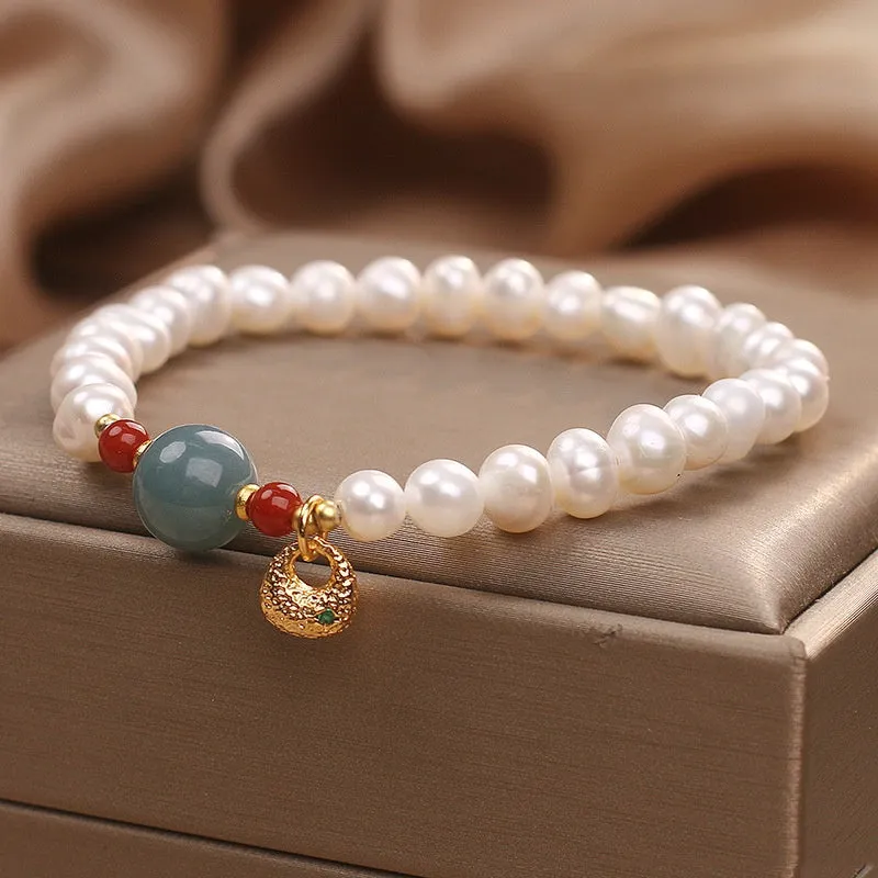 White freshwater pearl and aquamarine bracelet with opal centrepiece, ethnic style