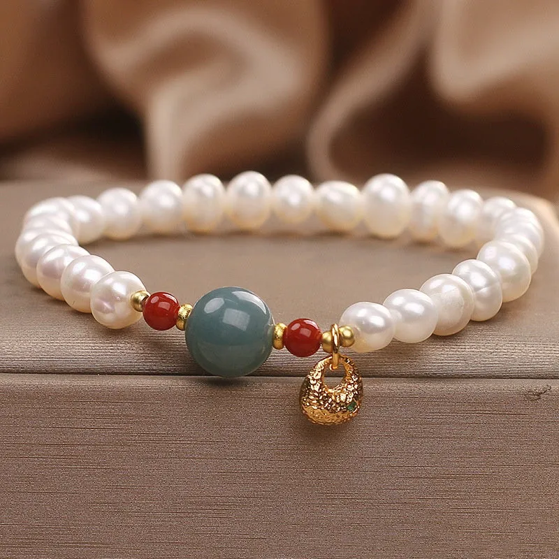 White freshwater pearl and aquamarine bracelet with opal centrepiece, ethnic style