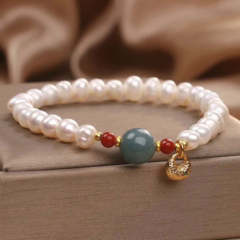 White freshwater pearl and aquamarine bracelet with opal centrepiece, ethnic style