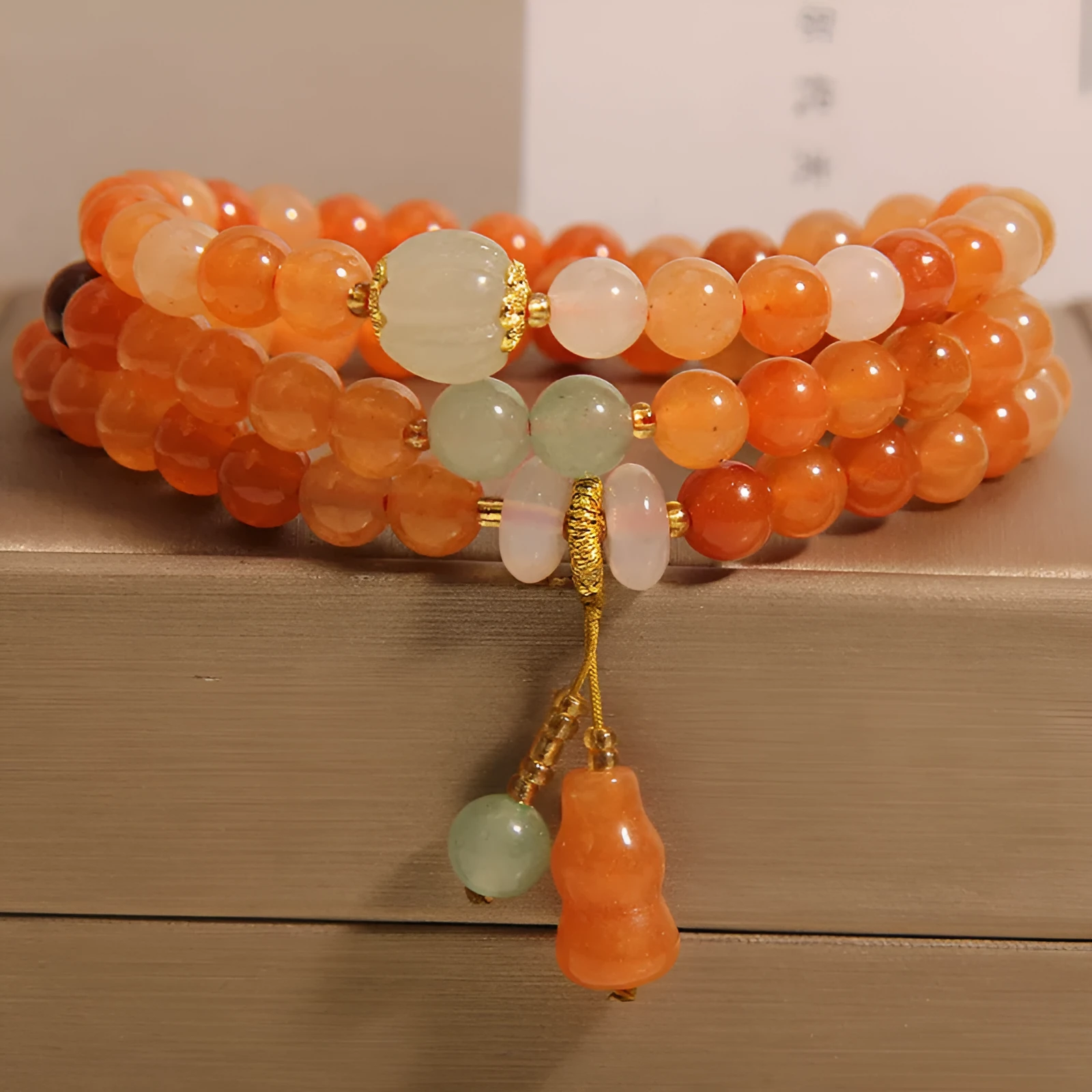 Artistic antique natural Jinsi Jade multi-layer bracelet with pumpkin beads and calabash pendant on white background