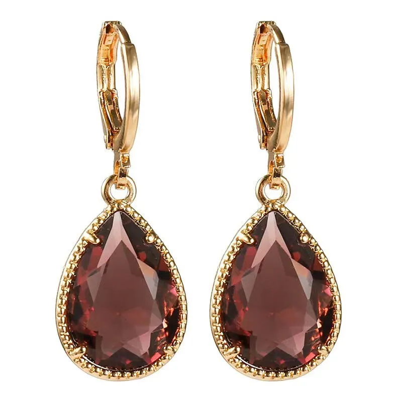 Hand-carved glass water drop earrings with geometric Saturn design in various colours