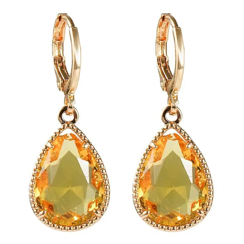 Hand-carved glass water drop earrings with geometric Saturn design in various colours