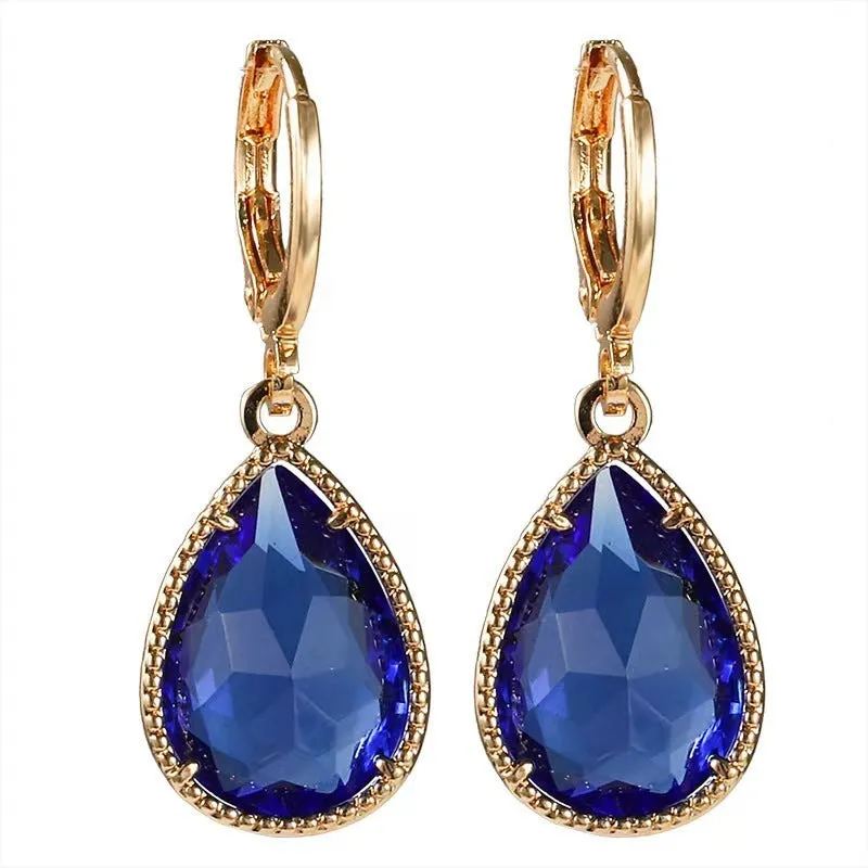 Hand-carved glass water drop earrings with geometric Saturn design in various colours