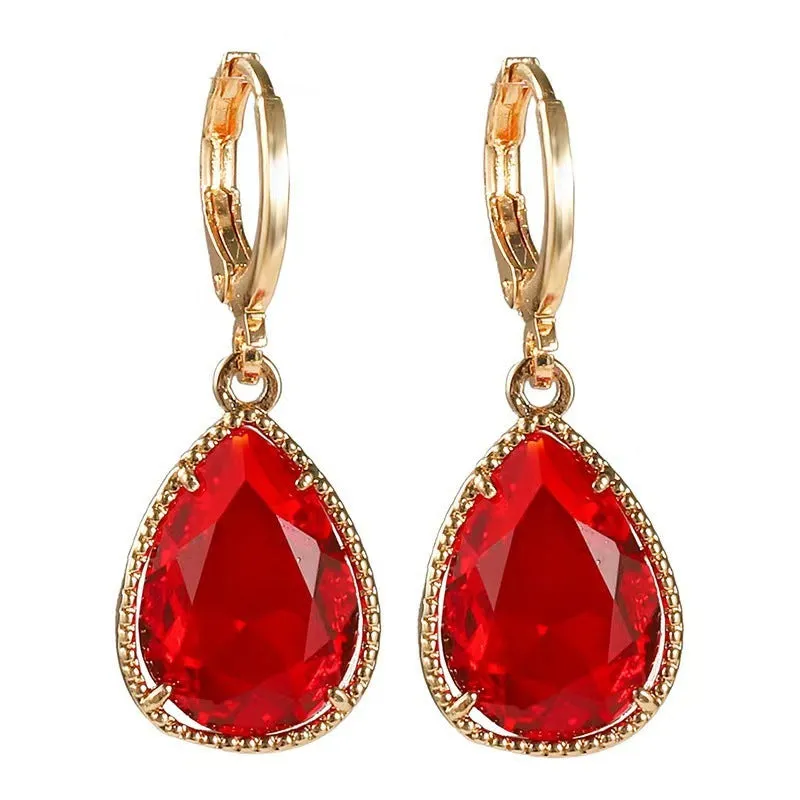 Hand-carved glass water drop earrings with geometric Saturn design in various colours