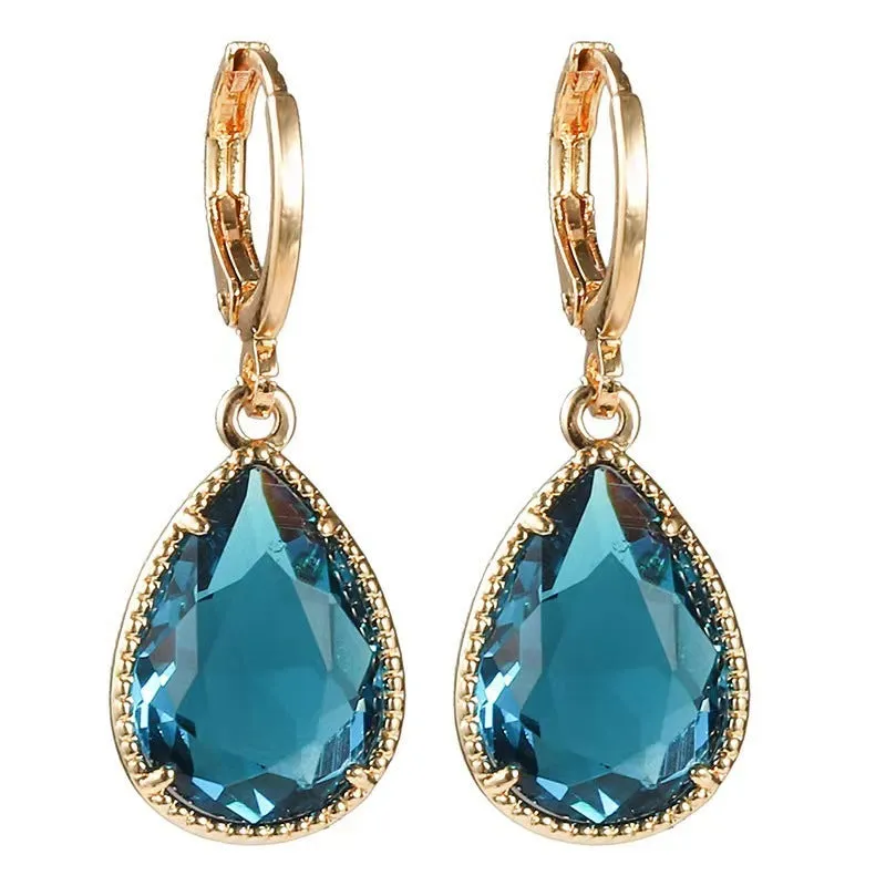 Hand-carved glass water drop earrings with geometric Saturn design in various colours