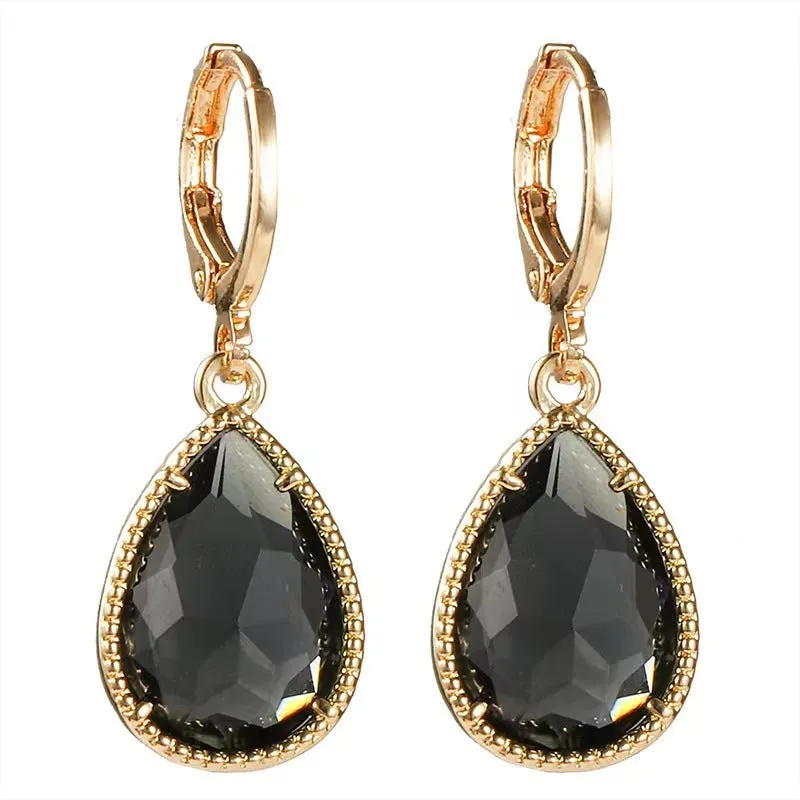 Hand-carved glass water drop earrings with geometric Saturn design in various colours