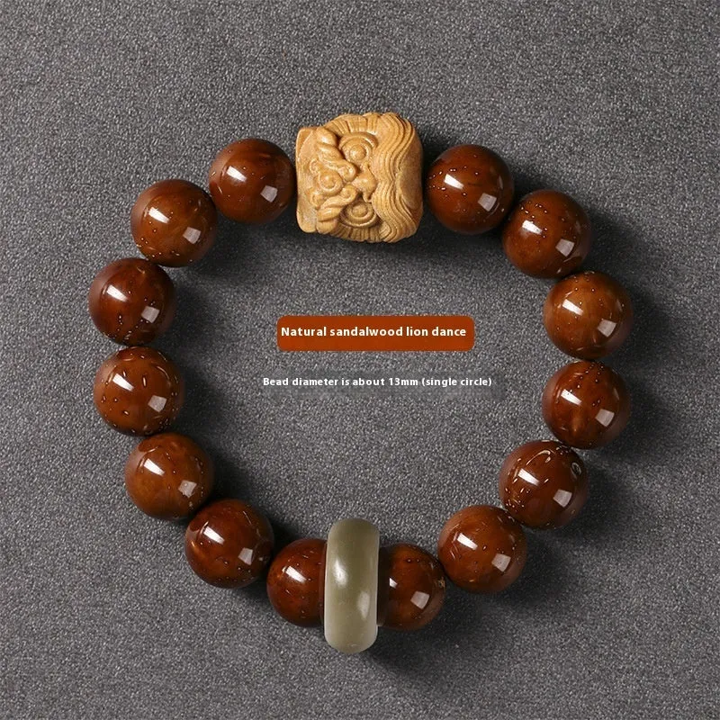 Hand-woven bracelet with 13mm round beads and a carved lion bead centrepiece in ivory nut style.