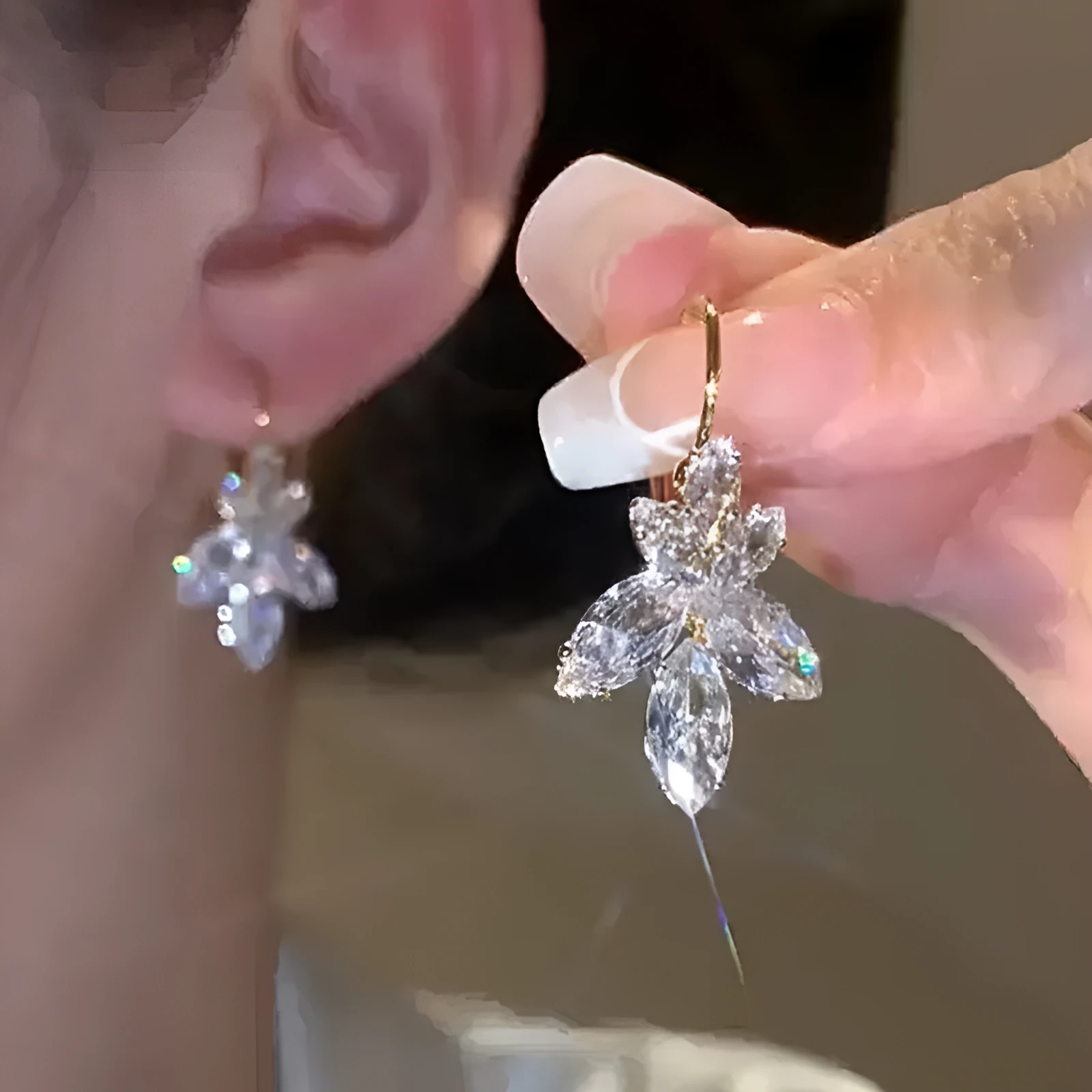 Women's platinum colour leaf earrings with inlaid zircon detailing on alloy background
