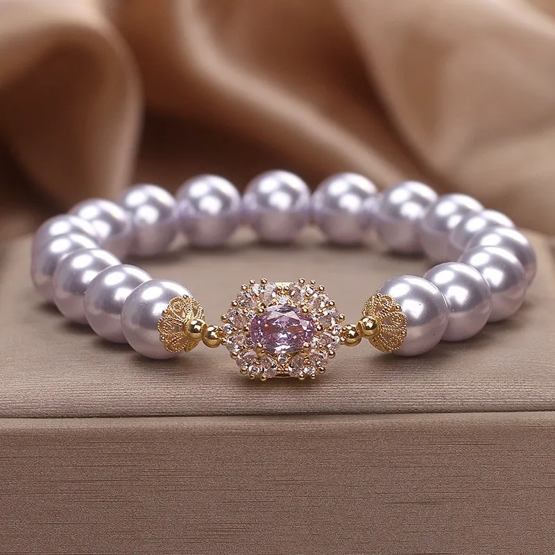Dreamy purple zircon pearl bracelet with diamond flower charm on wrist