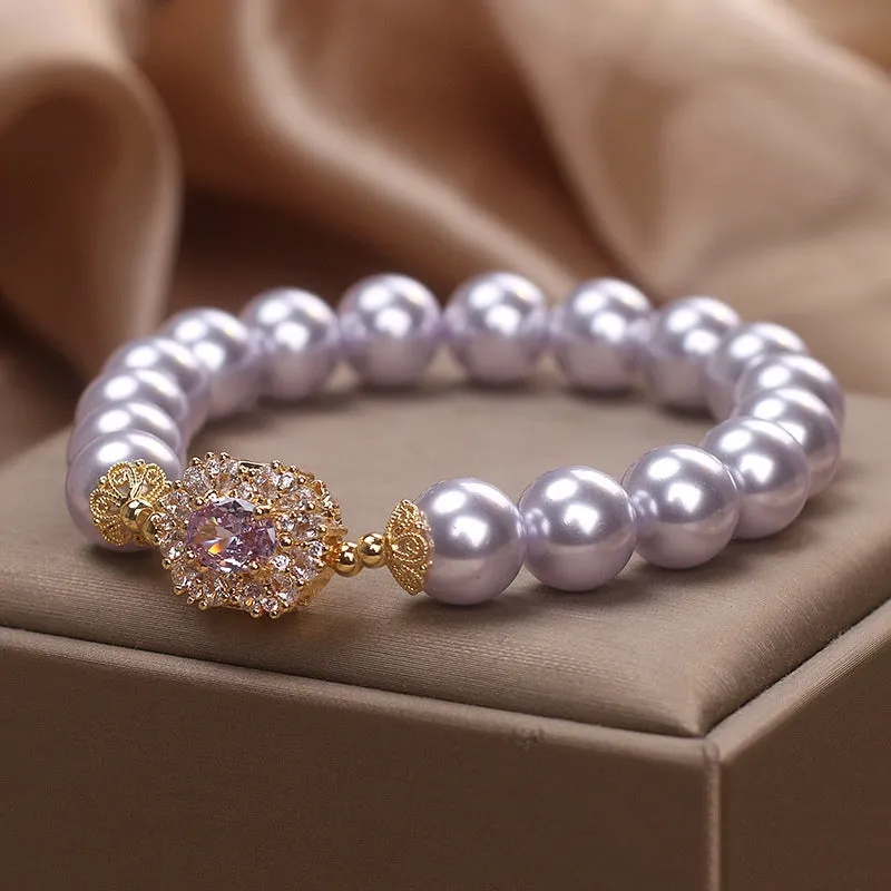 Dreamy purple zircon pearl bracelet with diamond flower charm on wrist