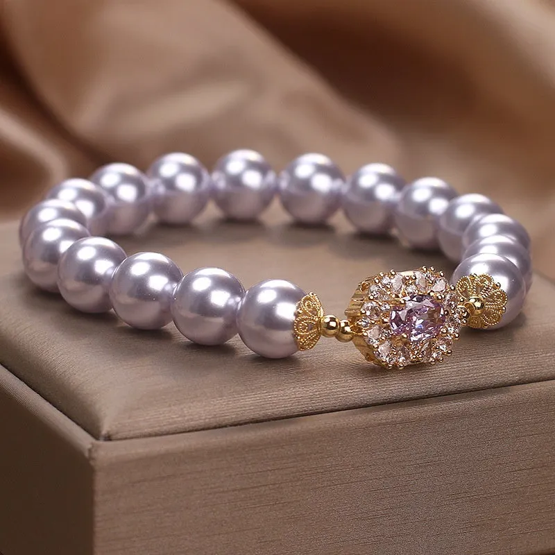 Dreamy purple zircon pearl bracelet with diamond flower charm on wrist