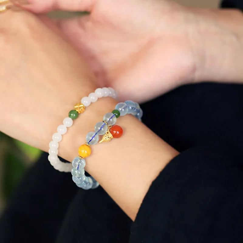 Close-up of a women's aquamarine bracelet with 8mm geometric beads in an iced translucent colour.
