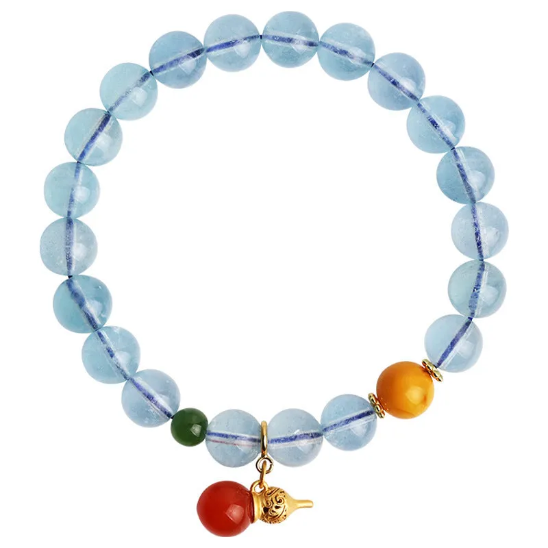 Close-up of a women's aquamarine bracelet with 8mm geometric beads in an iced translucent colour.