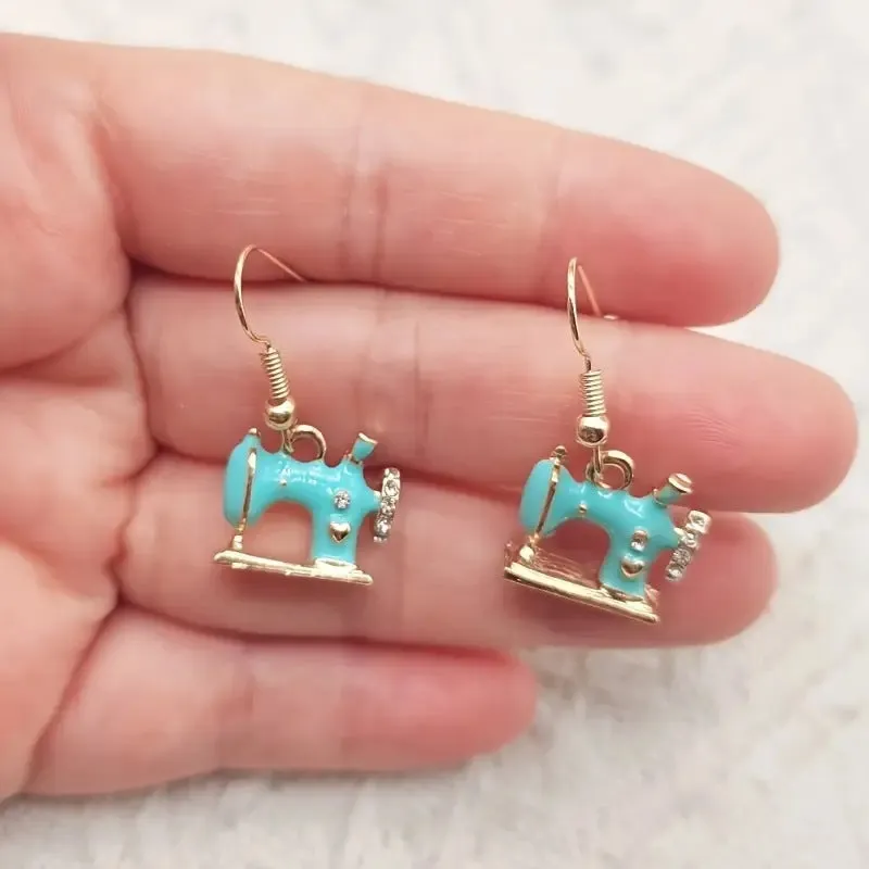 Pair of alloy vintage sewing machine earrings with oil drip finish in black colour