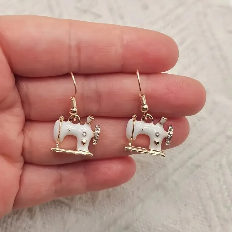 Pair of alloy vintage sewing machine earrings with oil drip finish in black colour