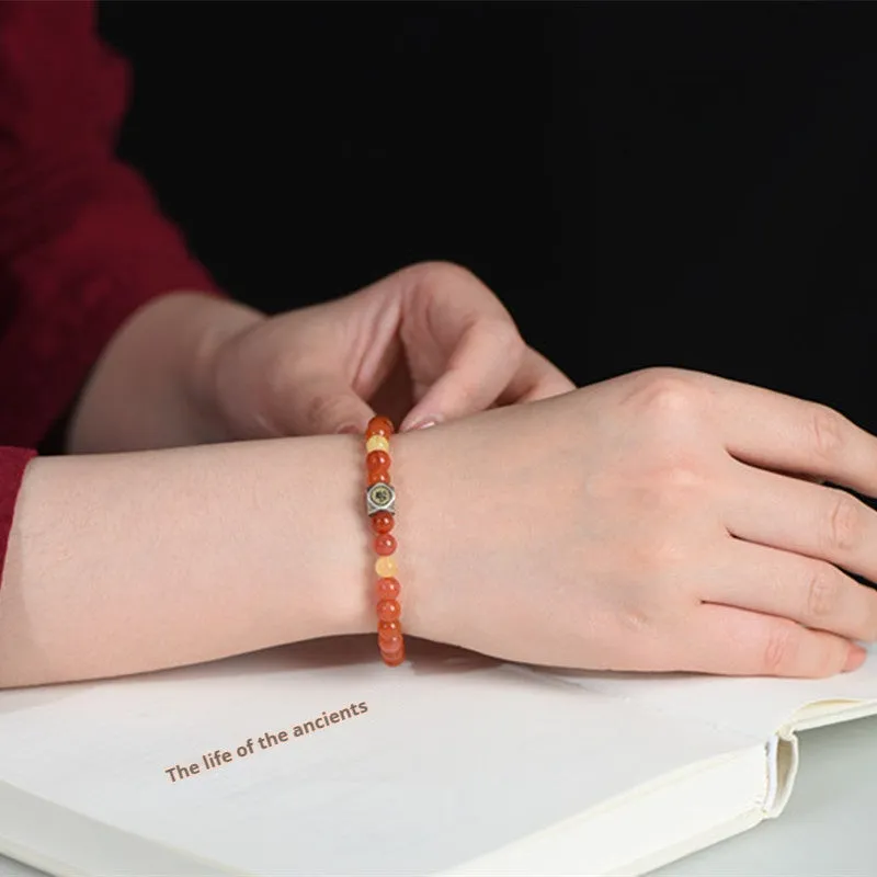 Natural Nanhong agate and beeswax zodiac bracelet with constellation charm in 6mm or 8mm bead size.