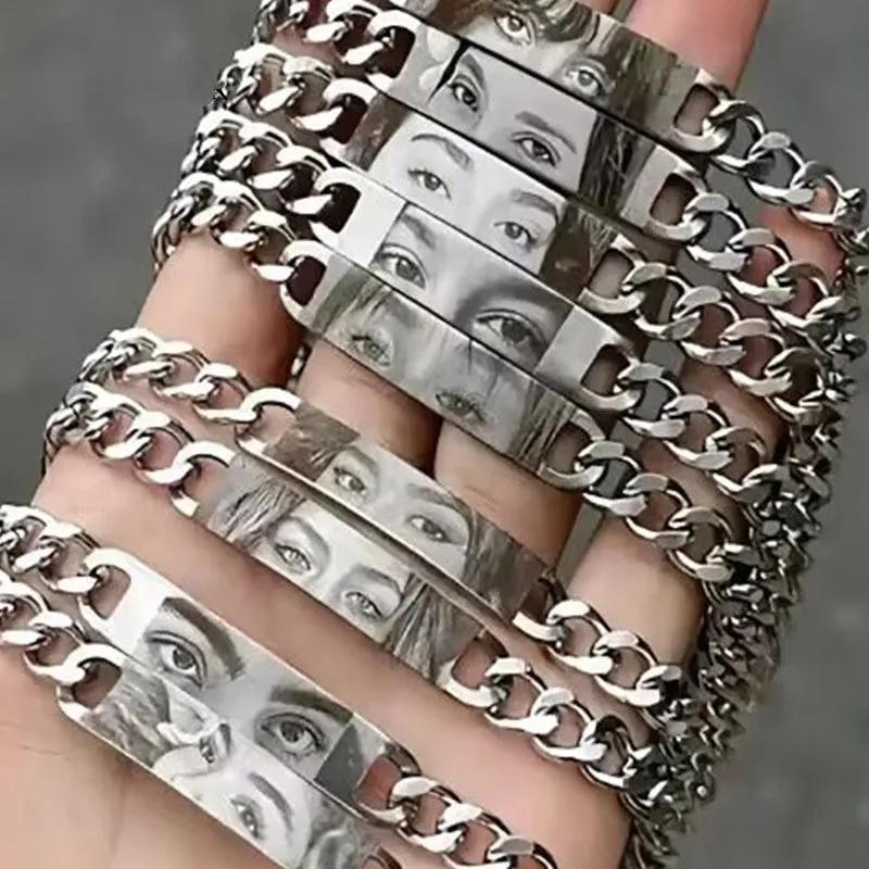 Personalised stainless steel bracelet with laser engraved human eye design, available in black, gold, and silver finishes