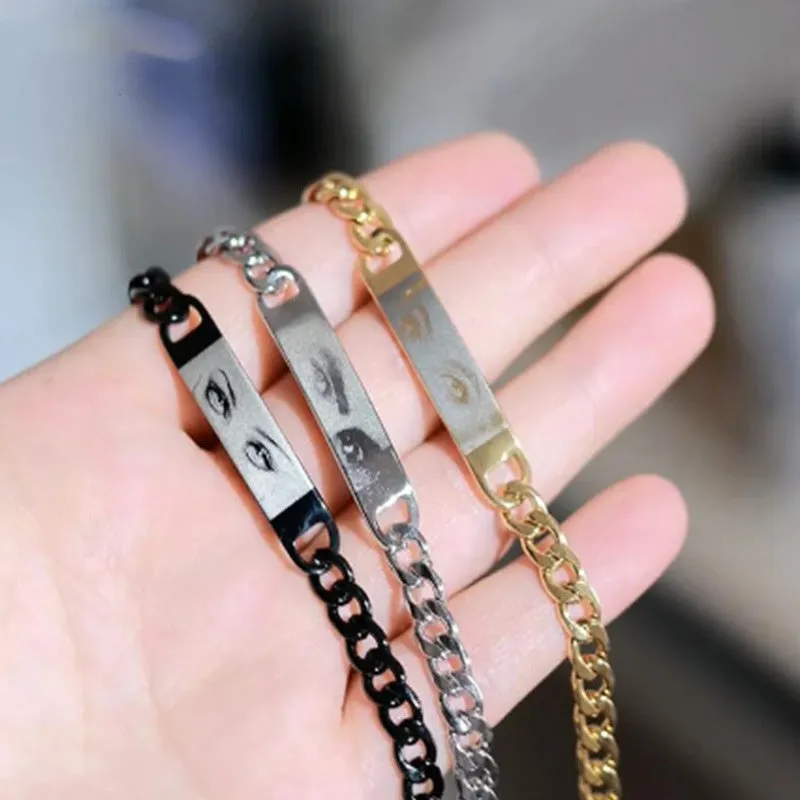 Personalised stainless steel bracelet with laser engraved human eye design, available in black, gold, and silver finishes