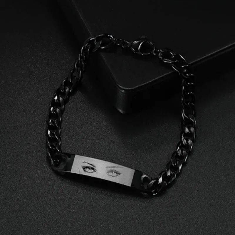 Personalised stainless steel bracelet with laser engraved human eye design, available in black, gold, and silver finishes