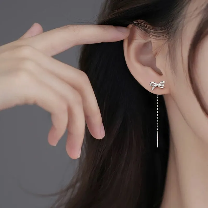 Women's white K bow earrings with long tassel ear thread, copper construction