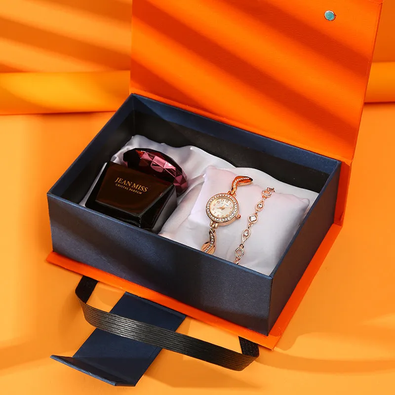 Gift set box containing watch, lipstick, perfume, and earrings in a red gift box with leather strap and metal case