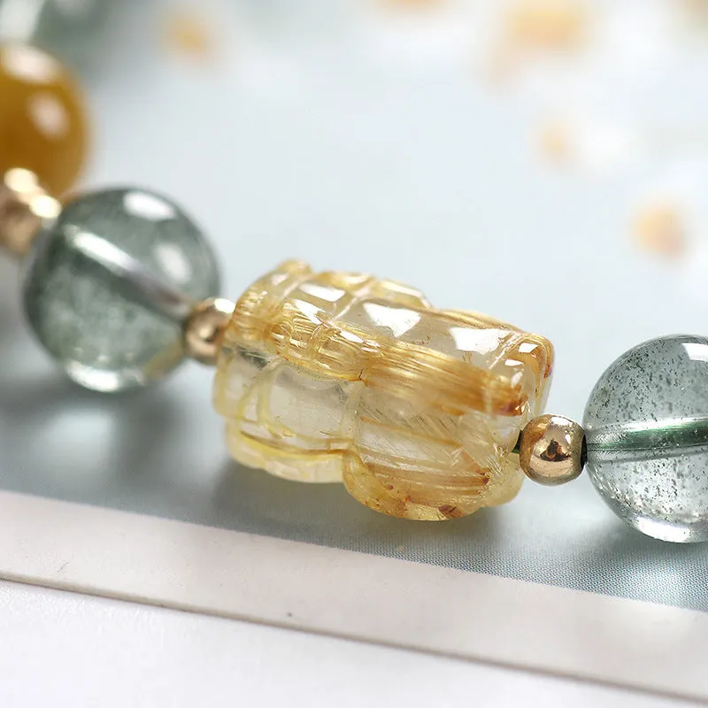 Green Phantom Quartz bracelet with gold rutile patterns in geometric 8mm beads