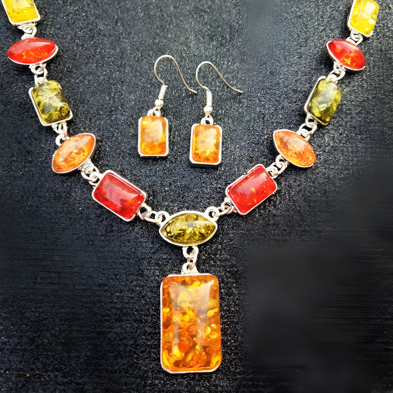Two-piece jewellery set with alloy electroplated white pendant necklace and earrings featuring artificial gems.