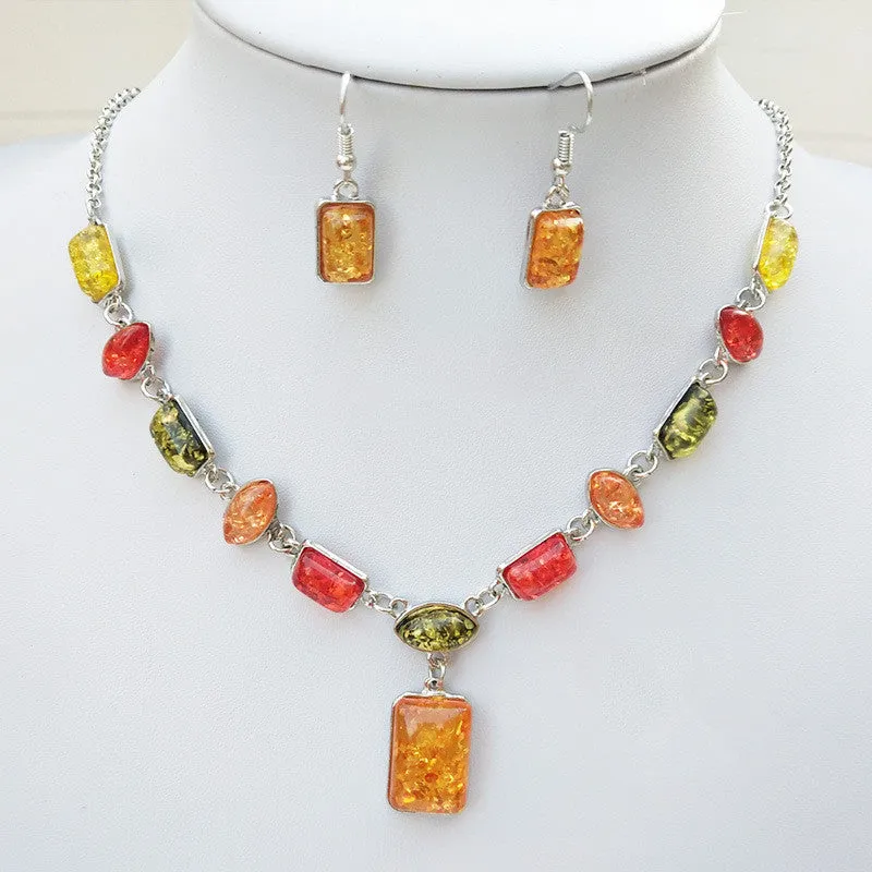 Two-piece jewellery set with alloy electroplated white pendant necklace and earrings featuring artificial gems.