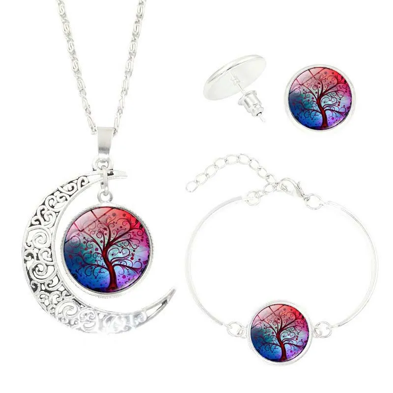 Tree of Life jewellery set with alloy and glass gem pendants: necklace, earrings, and bracelet on display