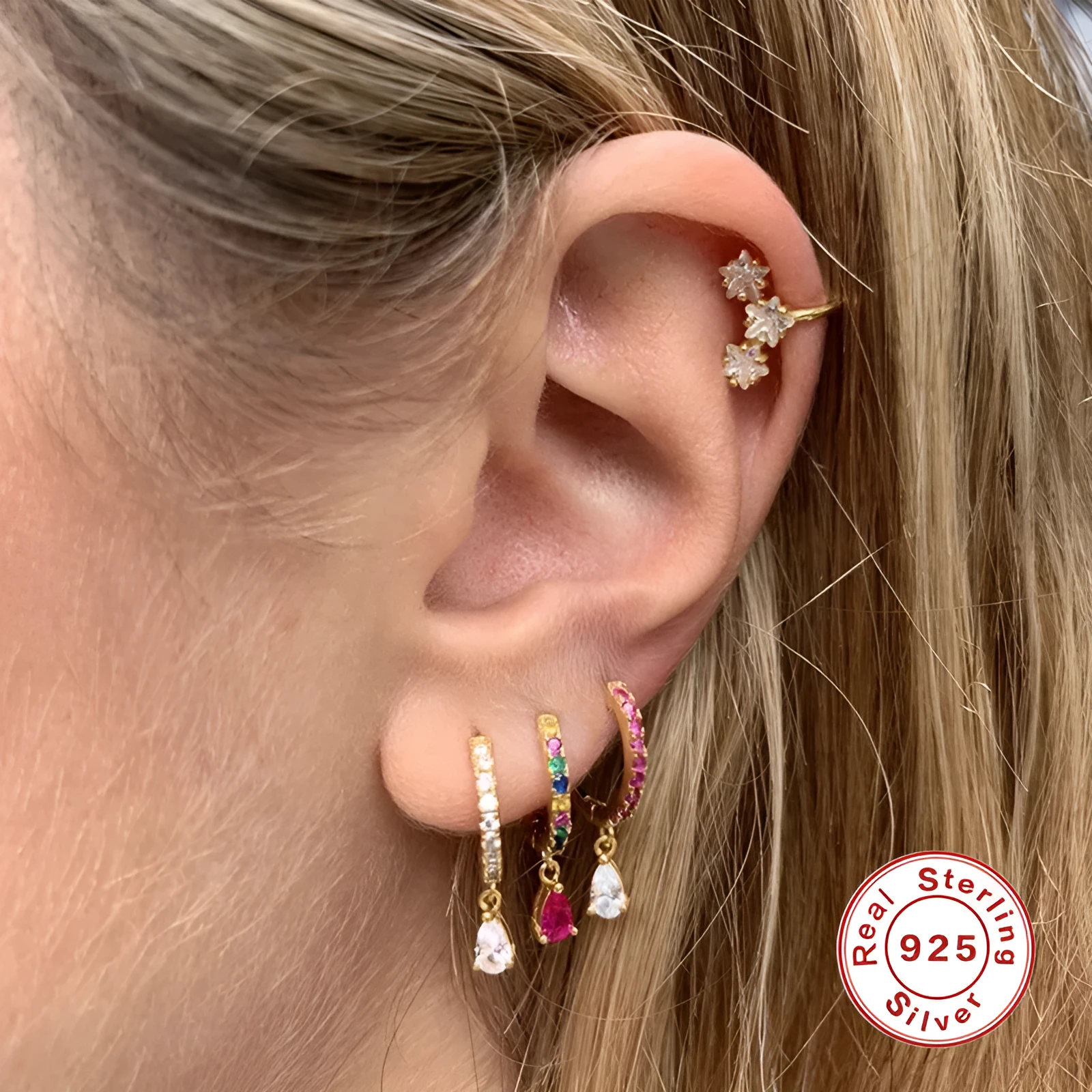 Geometric water drop sterling silver earring with a choice of gold or silver plating and decorative stone centre.