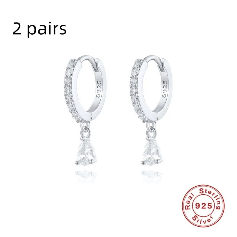 Geometric water drop sterling silver earring with a choice of gold or silver plating and decorative stone centre.