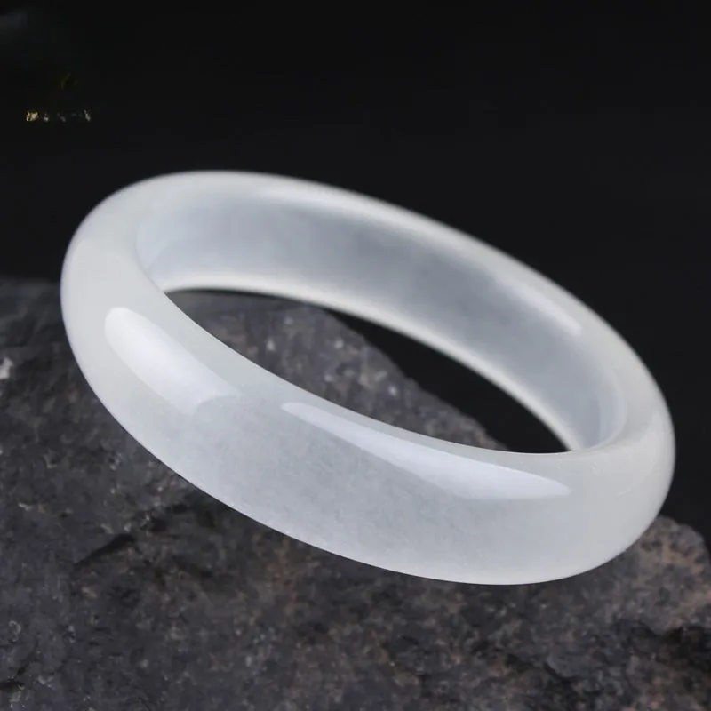 Gao bing jade bracelet in ice-white with flat rod and round rod style options on a wrist
