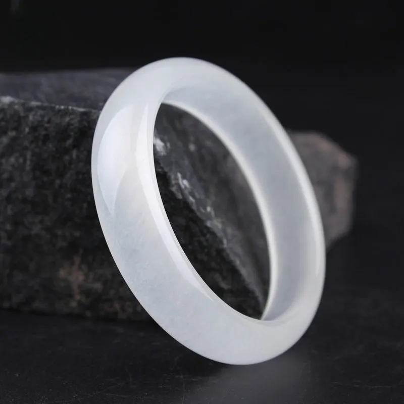 Gao bing jade bracelet in ice-white with flat rod and round rod style options on a wrist