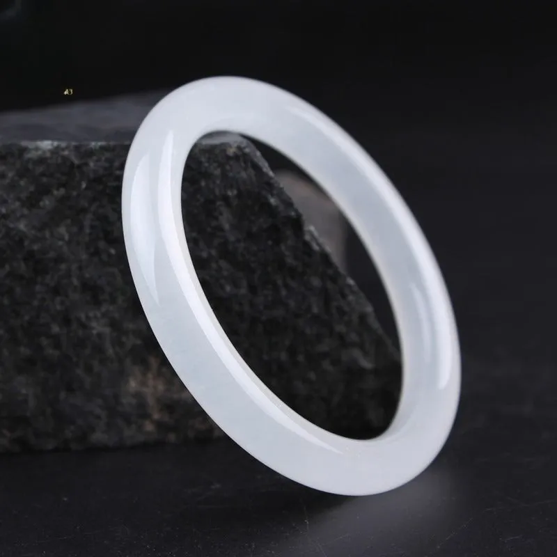 Gao bing jade bracelet in ice-white with flat rod and round rod style options on a wrist