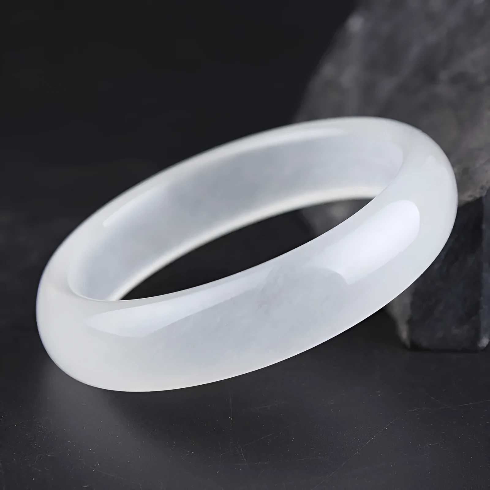 Gao bing jade bracelet in ice-white with flat rod and round rod style options on a wrist